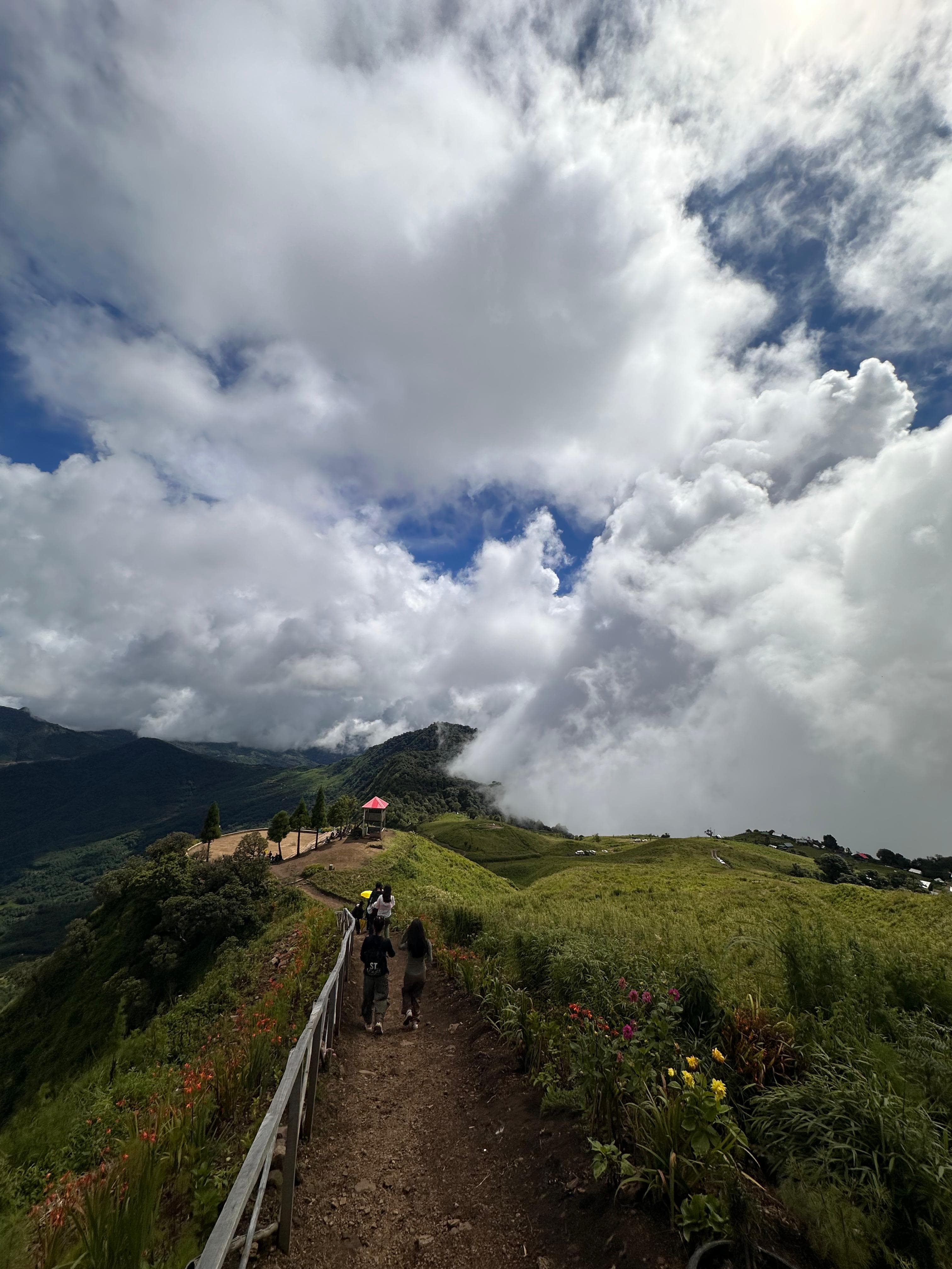 A walking trail along the green ridges of Kapamodzu