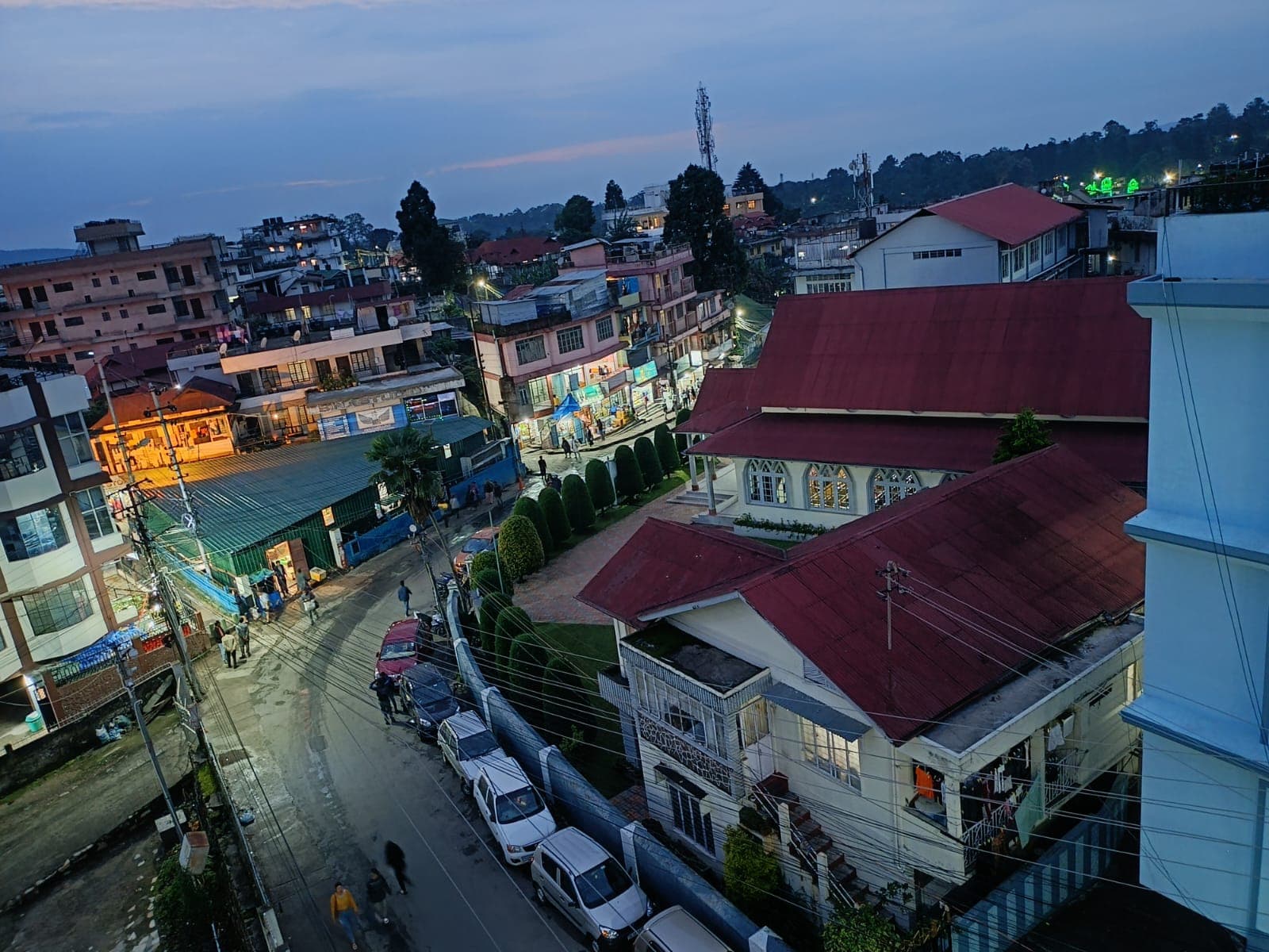 Shillong streets and rooftops as evening lights come on