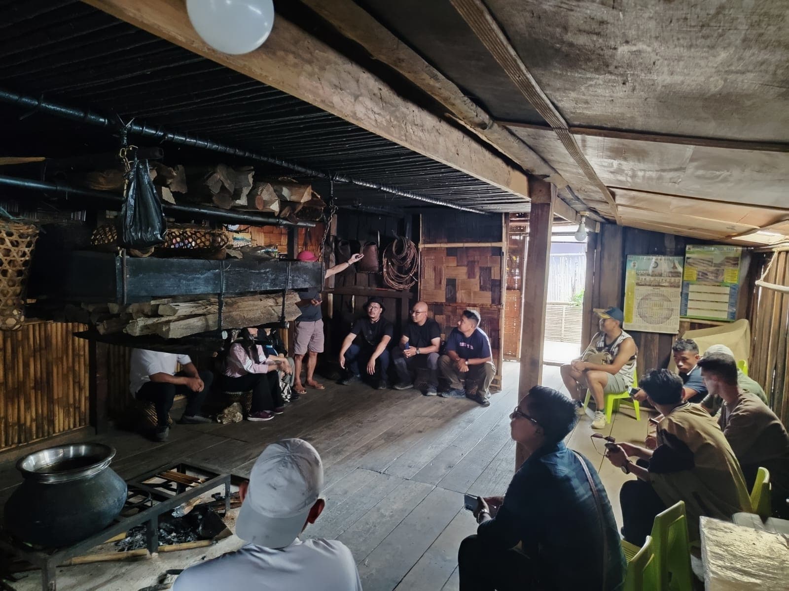 Sharing time around the hearth in a traditional home in Ziro
